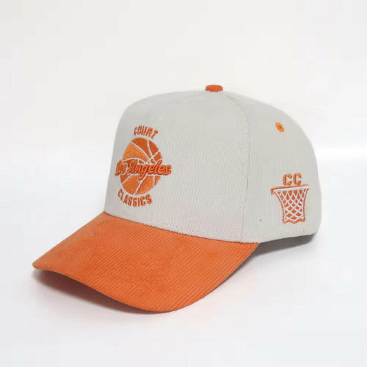 Side view of white & orange corduroy snapback hat featuring LA coordinates patch – Court Classics