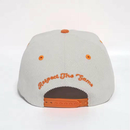 Back view of white & orange corduroy snapback hat with Respect the Game embroidery and adjustable snapback strap