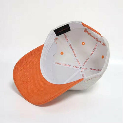 Interior view showing orange underbrim and Court Classics taping on white & orange snapback hat – 5-panel design