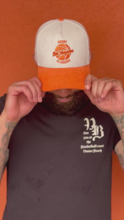 Video of white & orange Court Classics snapback hat in action